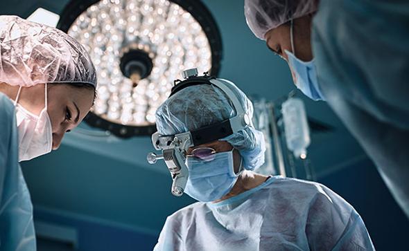 Surgeons in operating theatre for Natural Breast Implants